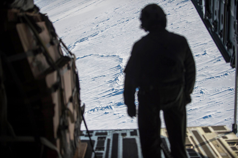 Illustration for article titled Check Out These Shots Of A C-17 Dropping Pararescuemen Over The Navy's Arctic OutpostÂ